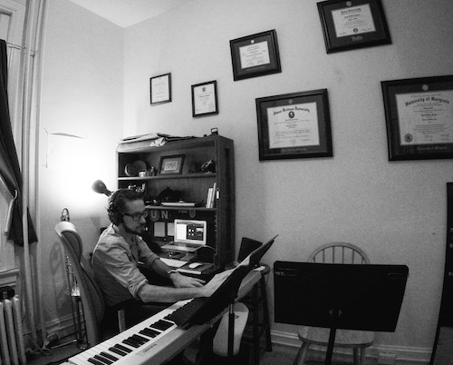 Black & white photograph of William at work in his studio